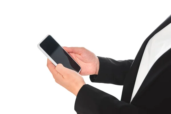 Partial view of businesswoman holding smartphone with blank screen isolated on white — Stock Photo
