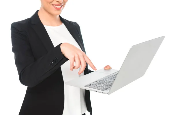 Vista parcial de sonriente mujer de negocios de raza mixta utilizando portátil aislado en blanco - foto de stock