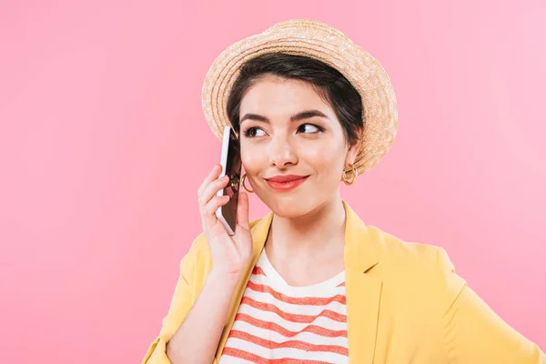 Pretty mixed race girl talking on smartphone and looking away isolated on pink — Stock Photo