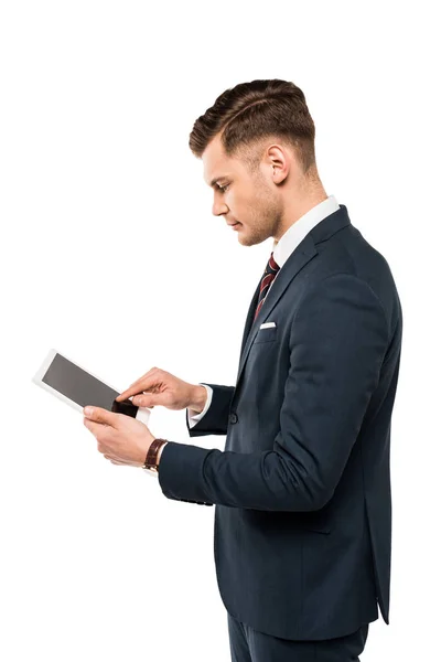 Красивий бізнесмен вказує пальцем на цифровий планшет ізольовано на білому — стокове фото