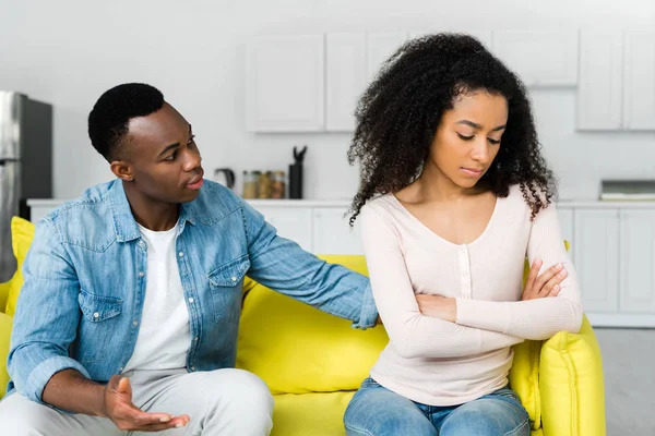 Worried african american man looking at upset woman — Stock Photo