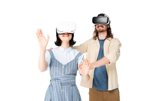 Young man holding girl while using VR headset isolated on white — Stock Photo