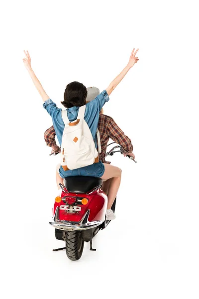 Vista posteriore di giovane uomo e ragazza mostrando segno di pace, seduto su scooter rosso isolato su bianco — Foto stock