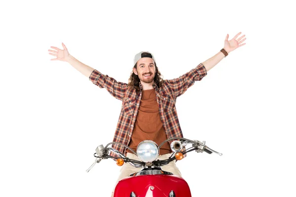 Visão frontal do jovem com as mãos no ar, sentado em scooter vermelho isolado no branco — Fotografia de Stock