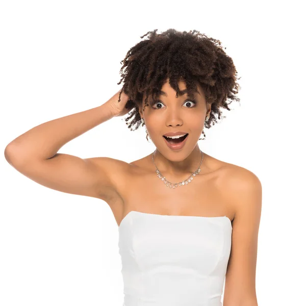 Shocked african american woman touching hair isolated on white — Stock Photo