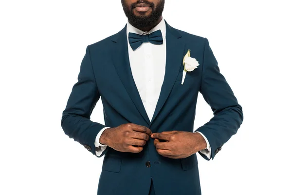 Cropped view of bearded african american man touching suit isolated on white — Stock Photo