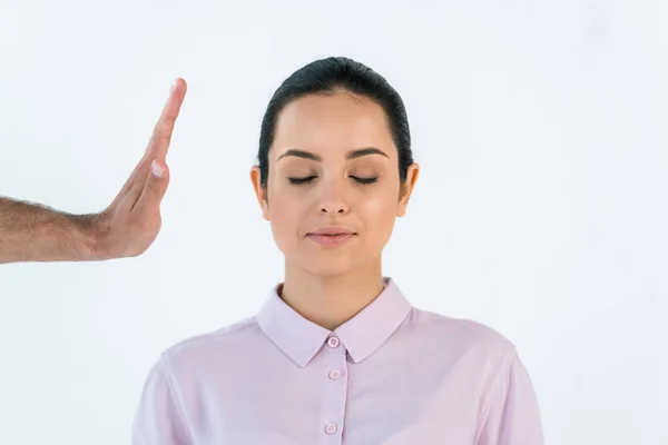 Cropped view of healer holding hand near attractive woman with closed eyes isolated on white — Stock Photo