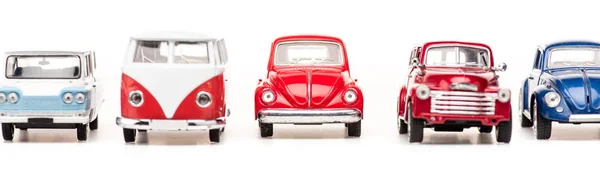 Panoramic shot of colorful toy cars and bus on white — Stock Photo