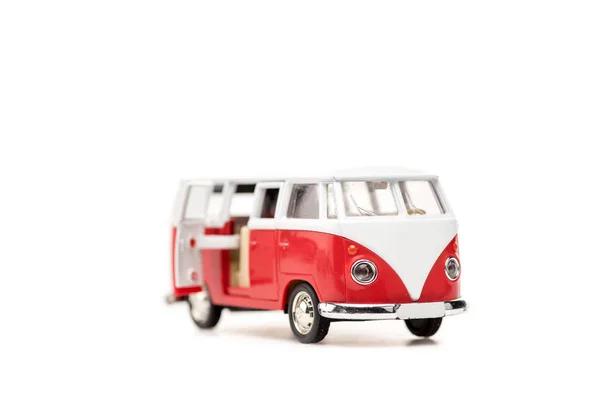 Selective focus of red toy bus on white with copy space — Stock Photo