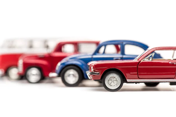 Selective focus of colorful toy cars on white — Stock Photo