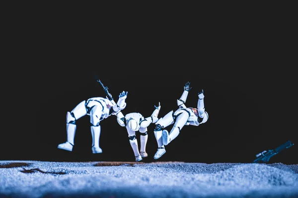 White plastic Imperial Stormtrooper levitating in space isolated on black — стоковое фото