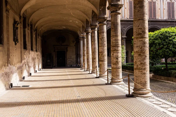 ROME, ITALY - JUNE 28, 2019: ancient building with columns and green trees — Stock Photo