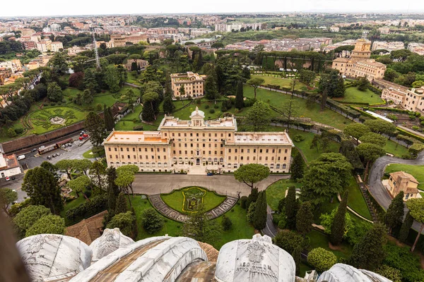 ROME, ITALY - JUNE 28, 2019: aerial view of old buildings and green park with trees — Stock Photo