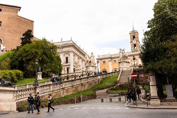 ROME, ITALY - JUNE 28, 2019: crowd of tourists walking on street — Stock Photo