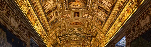 ROME, ITALY - JUNE 28, 2019: panoramic shot of golden ceiling with frescoes — Stock Photo