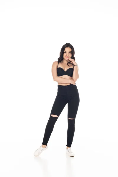 Full length view of smiling sexy girl in black bra and pants isolated on white — Stock Photo