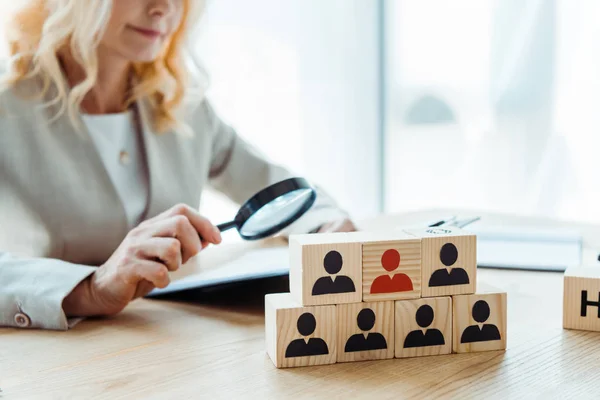 Selective focus of wooden cubes near blonde recruiter — Stock Photo