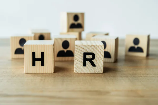 Selective focus of hr lettering on wooden cubes on table — Stock Photo