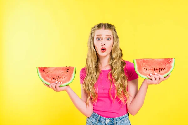 Beautiful surprised girl with watermelon slices On yellow — Stock Photo