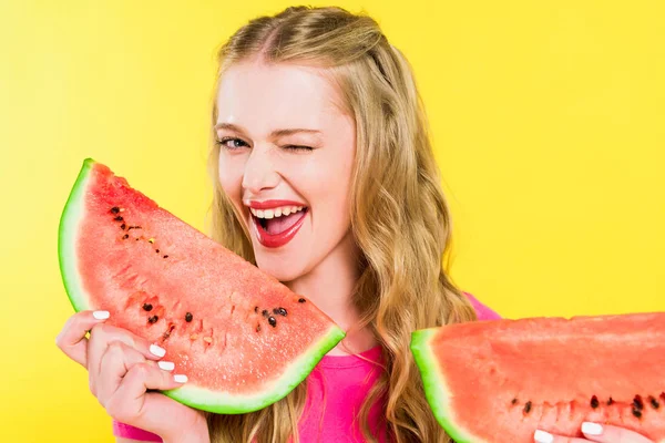 Beautiful girl with watermelon winking Isolated On yellow — Stock Photo