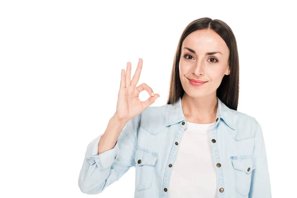 Smiling brunette woman showing ok sign isolated on white — Stock Photo