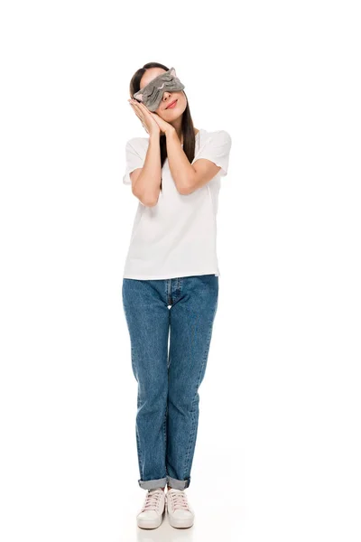 Brunette young woman in cat sleeping eye mask isolated on white — Stock Photo