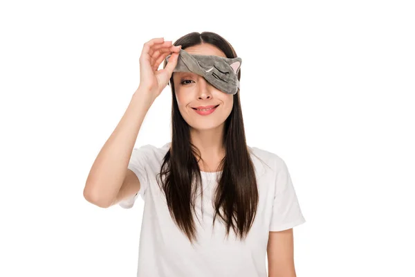 Smiling brunette young woman in cat sleeping eye mask isolated on white — Stock Photo