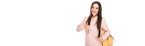 Smiling brunette girl with backpack showing thumb up isolated on white, panoramic shot — Stock Photo