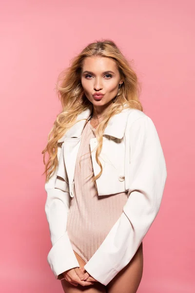 Beautiful blonde woman with duck face isolated on pink — Stock Photo