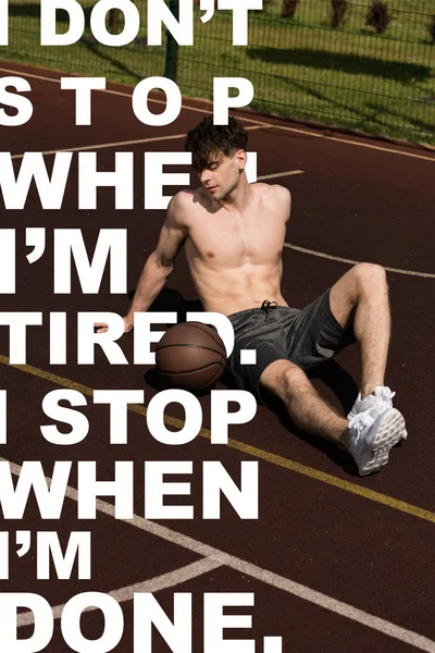 I dont stop when Im tired. I stop when Im done lettering on photo of shirtless sportsman with ball sitting at basketball court — Stock Photo