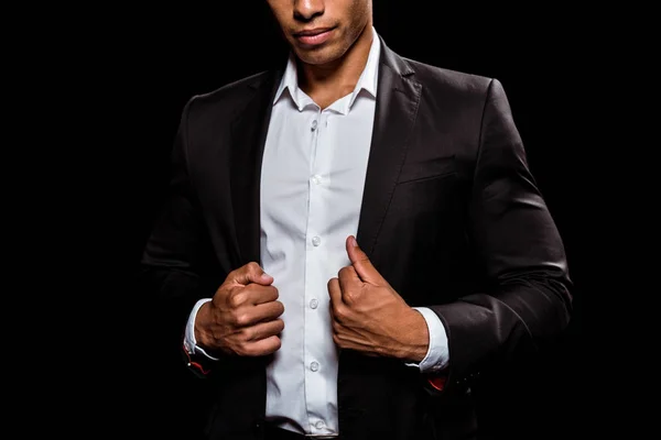 Cropped view of bi-racial man touching formal wear isolated on black — Stock Photo