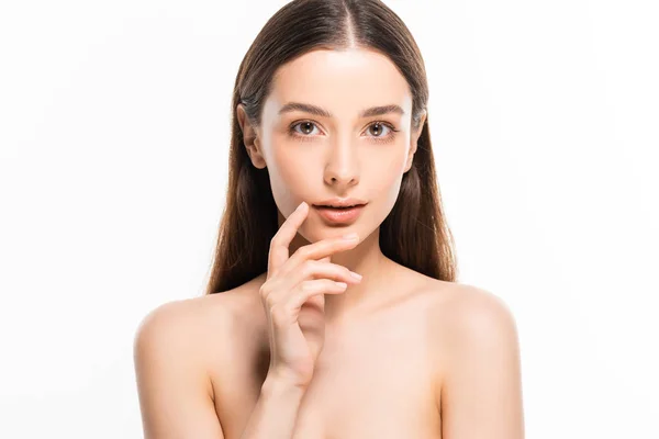 Brunette young naked woman with perfect skin touching face isolated on white — Stock Photo