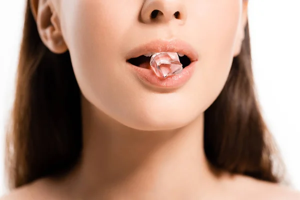 Cropped view of young naked woman holding ice cube in mouth isolated on white — Stock Photo