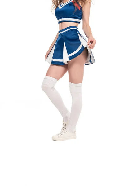 Vue partielle de sexy pom-pom girl en uniforme bleu isolé sur blanc — Photo de stock