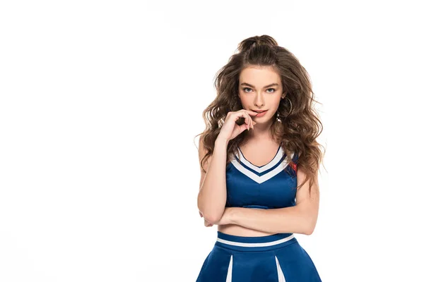 Sexy seductive cheerleader girl in blue uniform touching lips isolated on white — Stock Photo