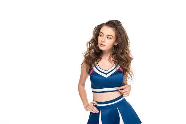 Sexy chica animadora reflexiva en uniforme azul aislado en blanco - foto de stock