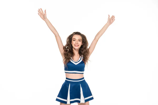 Fröhliche Cheerleader-Mädchen in blauer Uniform tanzen mit Händen in der Luft isoliert auf weiß — Stockfoto