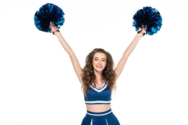 Chica animadora sonriente en uniforme azul bailando con pompones aislados en blanco - foto de stock