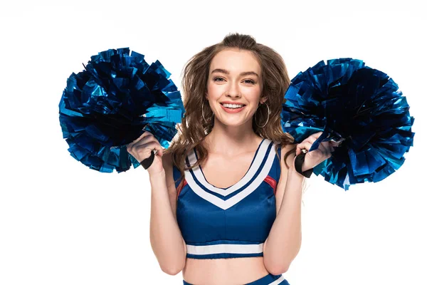 Fröhliches Cheerleader-Mädchen in blauer Uniform, das mit Bommeln auf weißem Grund tanzt — Stockfoto
