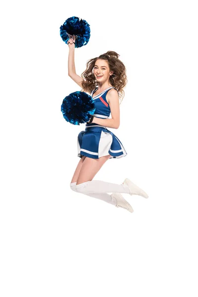 Вид в полный рост сексапильной счастливой девушки в синей форме, прыгающей с памперсами на белом — стоковое фото