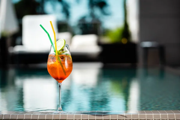 Selective focus of cocktail near swimming pool on resort with copy space — Stock Photo