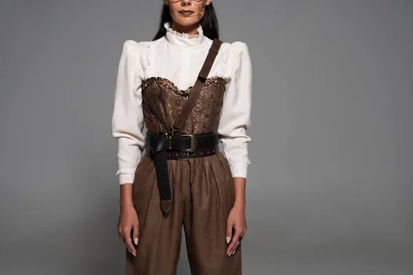 Partial view of steampunk woman in white blouse isolated on grey — Stock Photo