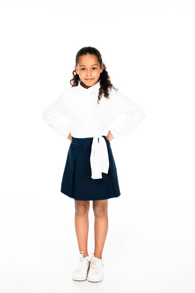 Full length view of smiling african american girl posing at camera on white background — Stock Photo