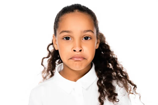 Upset african american schoolgirl looking at camera isolated on white — Stock Photo
