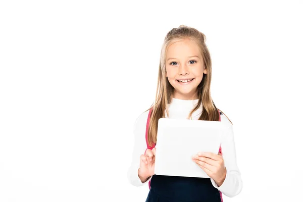 Adorable schoolgirl halding laptop and smiling at camera isolated on white — Stock Photo
