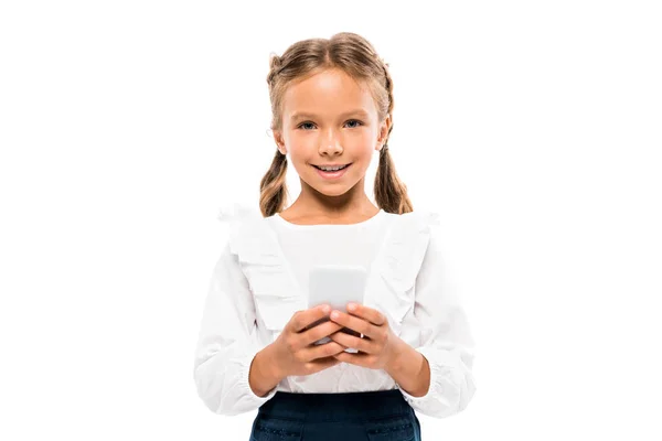 Criança alegre usando smartphone isolado no branco — Fotografia de Stock