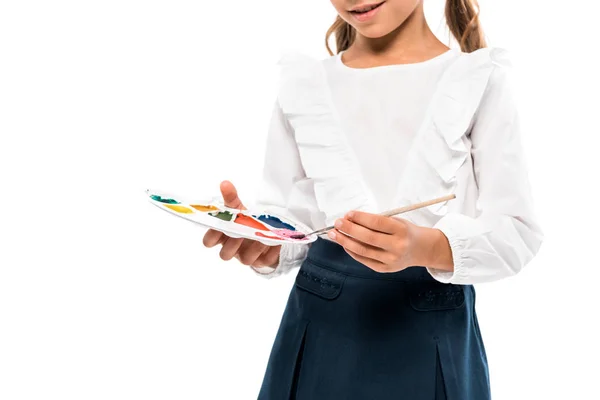 Cropped view of happy kid holding watercolor palette isolated on white — Stock Photo