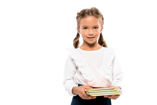 Cheerful child holding books isolated on white — Stock Photo