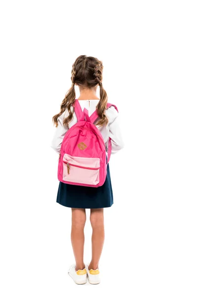 Rückseite Schulkind mit rosa Rucksack isoliert auf weiß stehend — Stockfoto