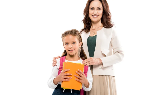 Happy mother touching shoulders happy daughter isolated on white — Stock Photo